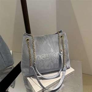 Minimalist light blue marble pattern tote bag with FASHION embossing and chain strap