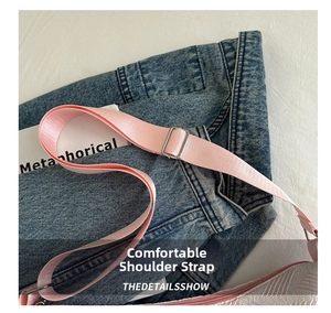 Detailed close-up of adjustable silver buckle on pink woven tote bag shoulder strap