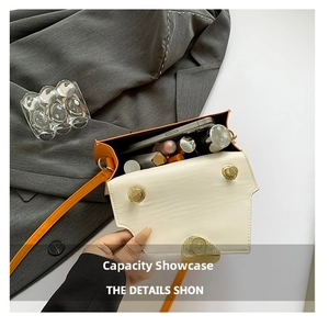 Interior view showing the storage capacity of the contrast leather crossbody bag