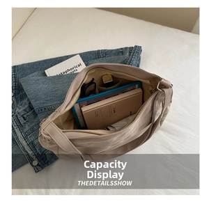 Large capacity hobo tote bag interior showing books, tablet and everyday essentials