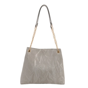 Minimalist grey tote bag with paper-like texture and gold chain strap on white background