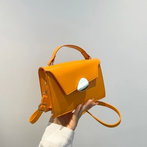 Minimalist orange leather satchel bag with silver metal buckle for women commuting