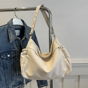 Minimalist off-white large capacity nylon tote bag with adjustable strap for daily commute