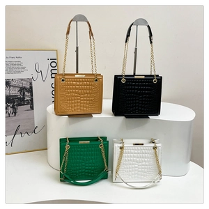 Trendy crocodile pattern tote bags with gold chains in brown, black, green and white