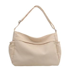 Minimalist beige large capacity canvas tote bag with adjustable shoulder strap and drawstrings