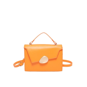 Chic vibrant orange leather crossbody bag with unique asymmetric flap and gold metal buckle
