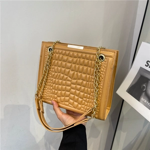 Retro ginger yellow crossbody bag with square embossed texture and golden chain strap