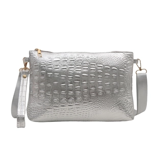 Silver crocodile embossed crossbody bag with detachable strap and wristlet handle