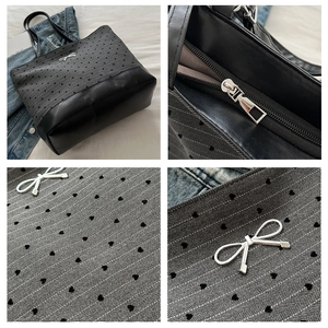 Close-up of heart patterned grey herringbone fabric and silver bow detail on tote bag