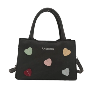 Black PU leather handbag with colorful heart patches and silver Fashion logo