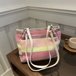 Rainbow striped woven shoulder bag with white leather straps and silver hardware detail