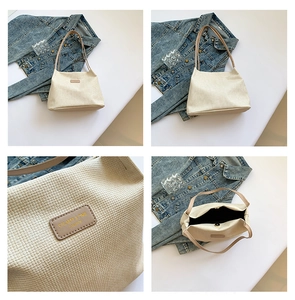 Detail of beige woven tote bag showing textured pattern, leather logo tag and magnetic closure