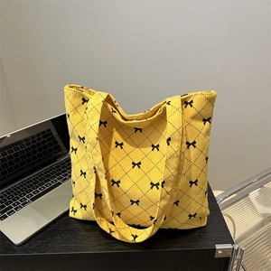Yellow corduroy tote bag with black bow lattice print and large capacity for daily use