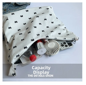 Top view of large white canvas tote bag showing interior space for phone and bottle
