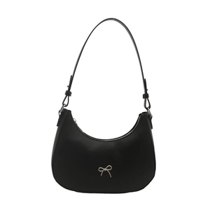 Minimalist black crescent shoulder bag with a polished silver metallic bow decoration