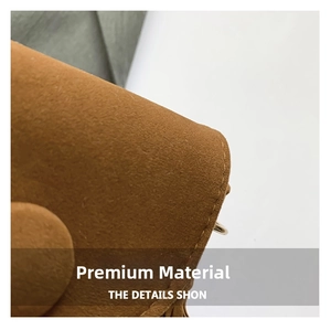 Detailed close-up of premium camel faux suede fabric with precise stitching and matching button