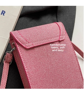 Close-up of pink tweed phone bag showing soft woven fabric texture and silver buckle