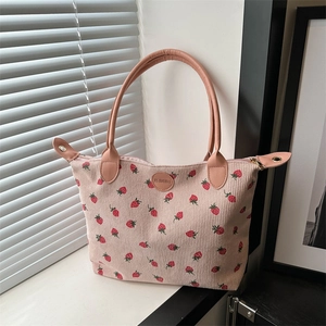 Pink corduroy tote bag with strawberry prints and orange leather handles for women