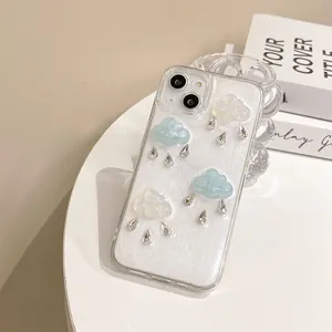 Detail of iPhone case with 3D clouds and rhinestone raindrops on silver glitter back
