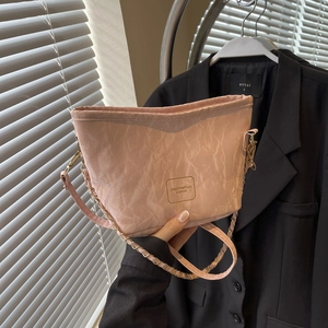 Stylish pink pleated tote bag with chain strap and crinkle texture for casual fashion