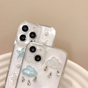 Detail of glitter iPhone case with 3D clouds, crystal raindrops, and pearls decoration