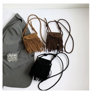 Bohemian style crossbody bags with long fringe tassels in black and brown suede textures