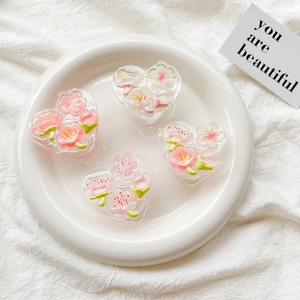 Sparkling pink cherry blossom heart phone socket set on a white decorative tray