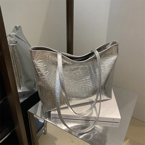 Large silver metallic tote bag with crocodile embossing and sleek shoulder straps