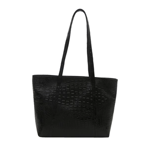 Minimalist large black crocodile pattern tote bag with shoulder straps on white background
