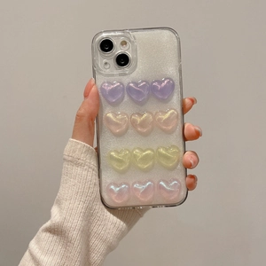 Main tenant coque iPhone transparente avec cœurs 3D pailletés en résine violet et or