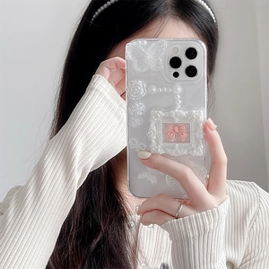 Transparent iPhone case with 3D butterflies, roses, pearls, and pink bow in a frame