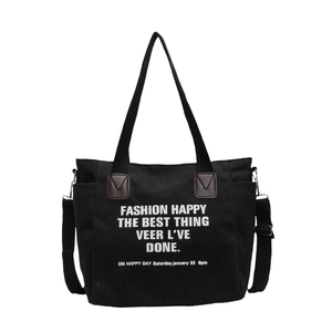 Grand sac cabas en toile noire avec bandoulière réglable et imprimé blanc minimaliste