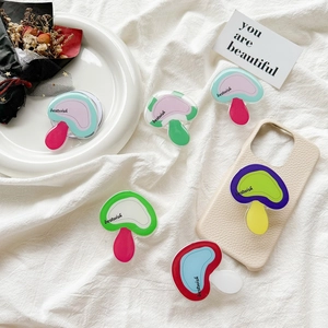 Cute mushroom phone grip holder with colorful acrylic top on white phone case