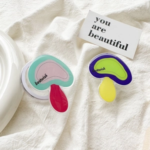 Detail of mushroom acrylic phone grip showing expandable airbag structure and bestwish text