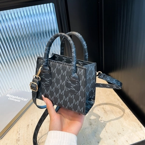 Retro mini tote bag in grey monogram print with black handles and gold hardware