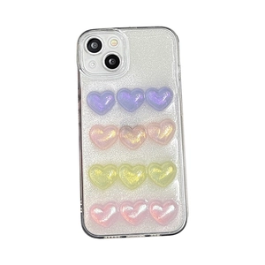 Coque iPhone transparente ornée de cœurs pailletés 3D violets, oranges, jaunes et roses