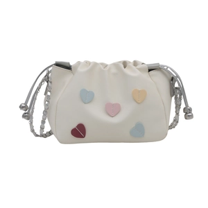 Chic beige drawstring bucket bag with colorful heart patches and silver chain strap