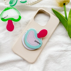 Detail of mushroom pop socket on cream faux leather phone case with litchi texture