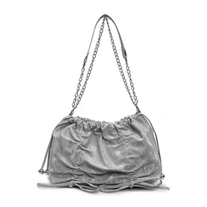 Grey pleated shoulder bag with metal chain strap and bow details on white background