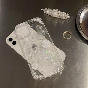 Detail of floral iPhone case with 3D butterflies, resin roses and sparkling pearls