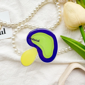 Macro detail of acrylic mushroom phone grip with bestwish print and vibrant colors