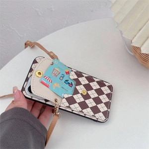 Detail of checkered leather iPhone case featuring a flip wallet card holder and crossbody strap