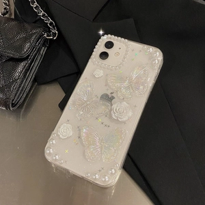 Floral iPhone case with 3D butterflies, pearls, and roses on a transparent glitter finish