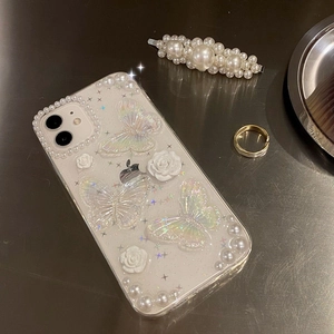 Detail of iPhone case with pearlescent floral motifs, 3D butterflies and glitter finish
