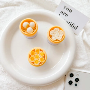Detailed view of creative dim sum shaped phone sockets on a white ceramic plate