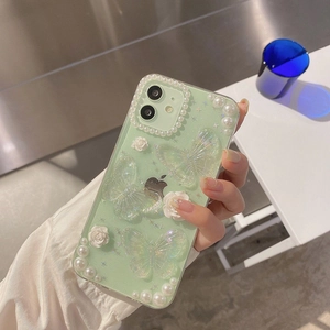 Floral iPhone case with 3D butterflies, mint green finish, and pearl border accents