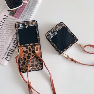 Vintage leopard print folding phone case with adjustable brown leather crossbody strap