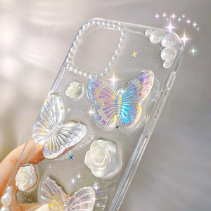 Detail of 3D laser butterfly, resin rose, and pearl chain on clear iPhone case