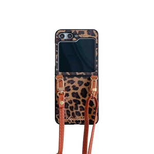 Vintage leopard print folding phone case with Aquarius logo and detachable strap
