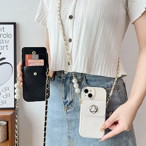 Quilted leather phone case with camellia detail, crossbody pearl strap and card holder